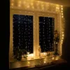 A window decorated with string lights and Christmas-themed items. Anteprima dell’immagine prodotto