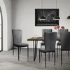 A dining room setting with a table and chairs. Náhled obrázku produktu