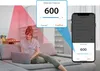 A woman is sitting on a couch using a laptop, with a graphic overlay showing a smartphone interface and a detection distance setting. Produktbild-Vorschau