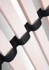 A close-up view of wooden slats and black straps, likely part of a bed frame or mattress support. Produktbild-Vorschau