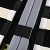 A close-up view of the internal structure of a bed frame, showing fabric straps and wooden slats. Produktbild-Vorschau