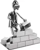 A metal figurine of a construction worker laying bricks. Náhled obrázku produktu