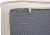 Close-up view of a corner of a cushion or mattress with a zipper and a textured gray underside. Anteprima dell’immagine prodotto