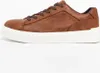 A side view of a brown leather sneaker with a white sole, set against a white background. Produktbild-Vorschau
