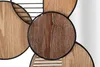 A close-up view of a decorative wall mirror with wooden circular elements and black metal framing. Produktbild-Vorschau