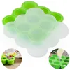 A collage of images showing silicone food molds for baby food, with one image showing food being spooned into a mold and another showing a creamy substance being dispensed into a mold. Produktbild-Vorschau