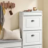 A hallway scene with a shoe cabinet, bench, and coat rack. Produktbild-Vorschau