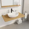 A bathroom sink area with a countertop, faucet, and accessories. Anteprima dell’immagine prodotto