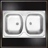 A stainless steel double sink with drains. Anteprima dell’immagine prodotto