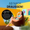 A woman in a bikini sits on a brown beanbag chair, eating an ice cream cone, with a bright, colorful background featuring abstract shapes and framed pictures of a flamingo and cacti. Náhled obrázku produktu