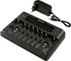 A black battery charger with multiple slots and a digital display, along with its power adapter and cable, is shown against a white background. Produktbild-Vorschau