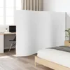 A white room divider is placed in front of a desk and a bed. Voir les images du produit