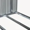 Close-up view of the corner joint of a metal structure, likely a shed or storage unit, showing the frame and corrugated metal panels. Podgląd zdjęcia produktu