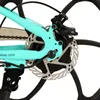 A close-up view of the rear disc brake and part of the frame of a turquoise electric bicycle. Produktbild-Vorschau