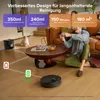 A robotic vacuum cleaner is shown on a wooden floor next to a coffee table with drinks and snacks. Two people are playing video games on a couch in the background. Information about the vacuum cleaner's features is displayed as text overlays. Produktbild-Vorschau