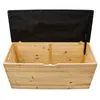 An open wooden chest with a black upholstered lid. Anteprima dell’immagine prodotto