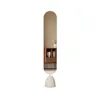 A tall, oval-shaped mirror with a rounded top and a rounded base, standing on a white background. A small wooden cabinet with books is reflected in the mirror. Produktbild-Vorschau