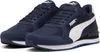 A pair of navy blue Puma sneakers with a white stripe on the side, shown from a slightly elevated front-left angle against a white background. Anteprima dell’immagine prodotto