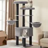 A multi-level cat tree with three cats on it, placed in a room with curtains and a sofa. Produktbild-Vorschau