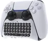 A white and black gaming controller with an attached keyboard. Produktbild-Vorschau