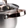 A close-up view of a stainless steel pot with gold-colored handles and a glass lid. Náhľad obrázku produktu