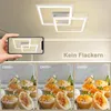 A hand holding a smartphone displaying a ceiling light, with three comparison images of cupcakes under different CRI lighting conditions below. Produktbild-Vorschau