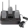 A black multi-charger base with three walkie-talkies plugged in, and a power adapter connected to the base. Anteprima dell’immagine prodotto