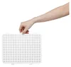 A hand is shown holding a white dehumidifier accessory or part. Náhled obrázku produktu