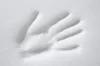 A handprint impression in white foam material. Produktbild-Vorschau