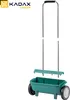 A garden spreader with a green hopper and silver handle, shown on a white background. Podgląd zdjęcia produktu