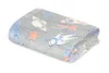 A folded blanket with a space-themed pattern, including planets, stars, and astronauts. Náhled obrázku produktu