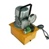 A hydraulic pump with a pressure gauge and a control unit, set against a white background. Podgląd zdjęcia produktu