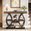 A console table placed in a hallway or entryway, next to a staircase. Voir les images du produit