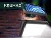 A solar-powered outdoor light with a motion sensor is mounted on a brick wall. Anteprima dell’immagine prodotto