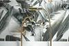 A close-up view of a bathtub faucet with a tropical leaf-patterned tile background. Náhľad obrázku produktu