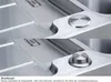 A close-up view of a stainless steel sink with a push-button drain control, shown in two states: depressed and extended. Produktbild-Vorschau