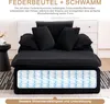 A black sofa with pillows, showing an internal view of the springs. Náhled obrázku produktu