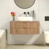 A modern bathroom vanity with a vessel sink and floral arrangement. Anteprima dell’immagine prodotto