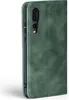 A green flip cover case for a Huawei P20 Pro phone, shown from the side. Produktbild-Vorschau
