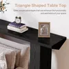 A black console table with books and a picture frame on top, placed behind a sofa. Produktbild-Vorschau