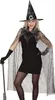 A woman wearing a witch costume, including a dress, cape, gloves, and hat, holding a broomstick. Anteprima dell’immagine prodotto