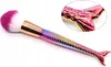 A single makeup brush with a mermaid tail handle and a pink and white brush head, shown against a white background. Podgląd zdjęcia produktu