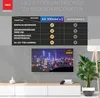 A comparison table showing features of a RED OPTICUM AX 300mini v.3 receiver against other products, with a TV displaying a city skyline in the background. Produktbild-Vorschau