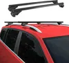 Two sets of black roof racks are shown, one set mounted on the roof of a red car, and another set displayed separately above the car. Produktbild-Vorschau