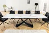 A dining room with a marble-topped table and black chairs. Produktbild-Vorschau