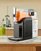 A slush machine filled with orange liquid sits on a kitchen counter, with a glass of green smoothie in the foreground. Náhled obrázku produktu