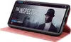 A smartphone in a pink flip case is displayed, showing a movie interface on its screen. Produktbild-Vorschau
