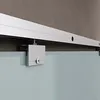 A close-up view of a sliding glass door system, showing the track and a roller mechanism attached to a frosted glass panel. Produktbild-Vorschau