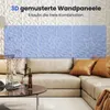 A living room scene with a sectional sofa, coffee table, and a wall decorated with 3D wall panels. Voir les images du produit