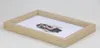 A framed picture of a woman with dark hair and red accents on a white background. Produktbild-Vorschau